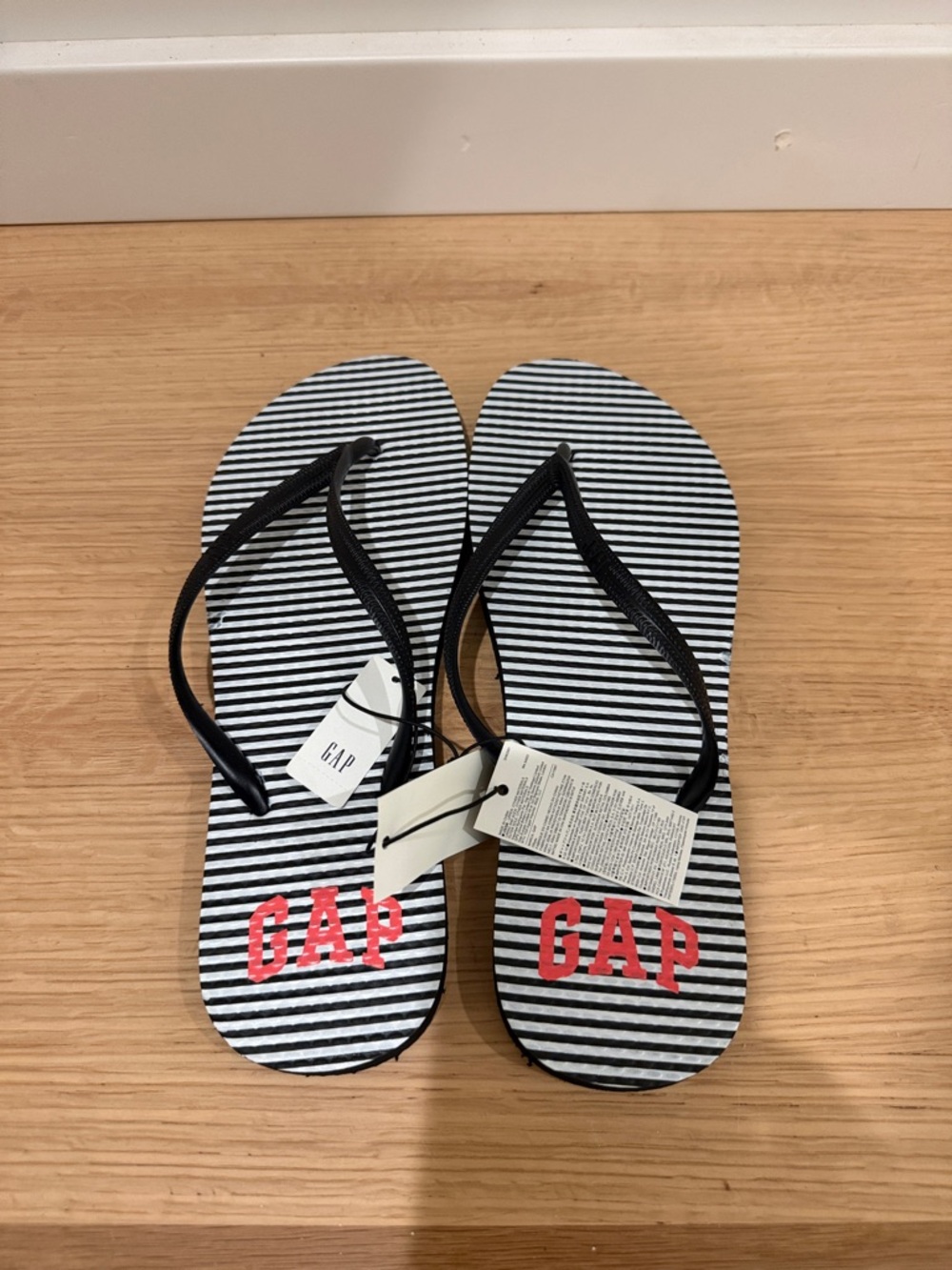 GAP Black & White Striped Flip Flops with Red Logo
